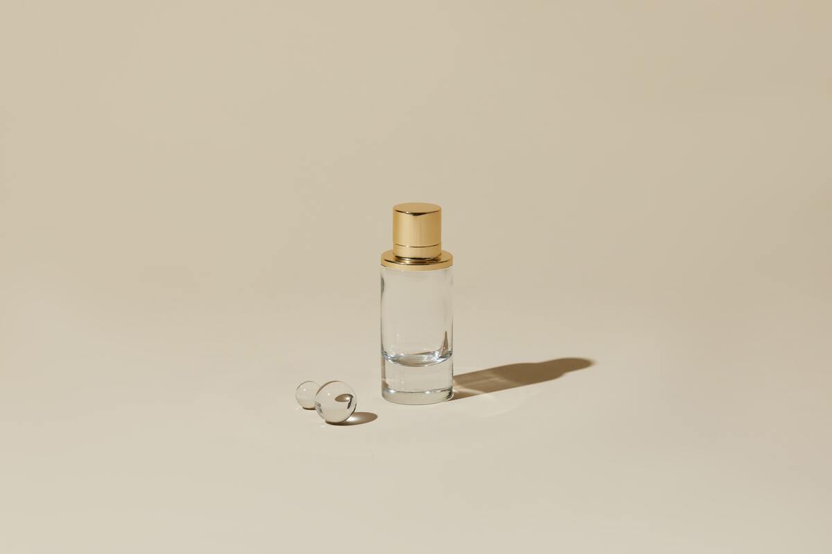 Clear Glass Bottle with Gold Top and Spray